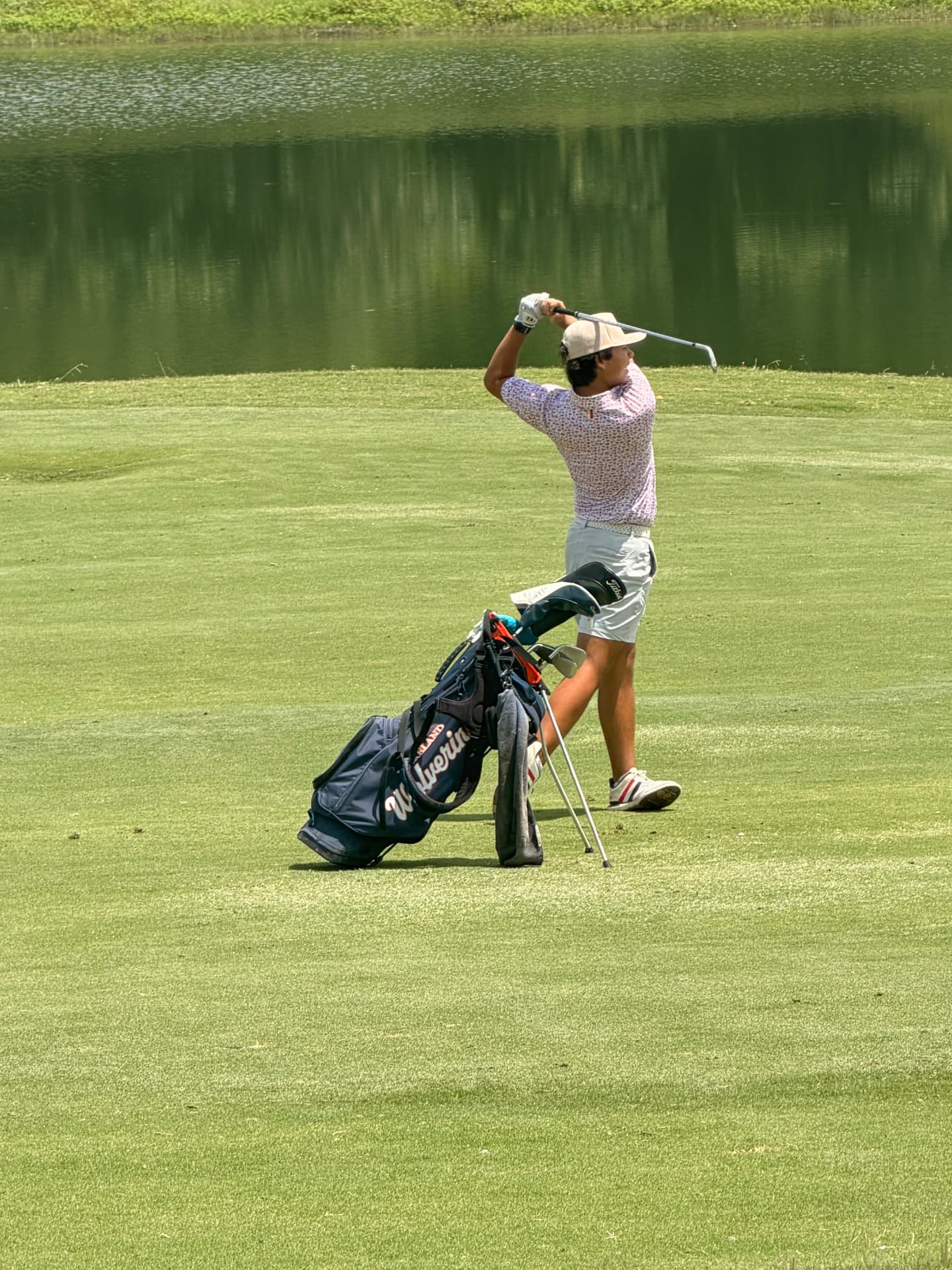 Hunter Nguyen mid-swing on the golf course